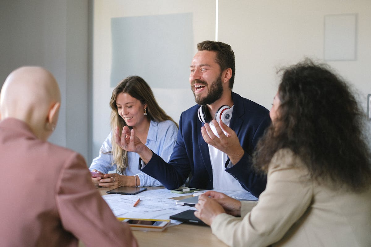 Group of cheerful businesspeople discussing strategy